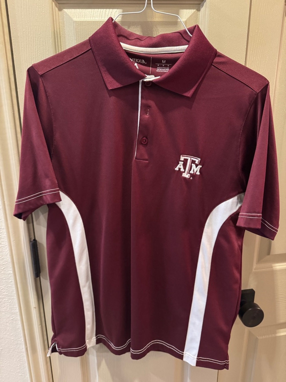 Texas Aggie Antigua Maroon and White Men’s Polo with Embroidered Logo